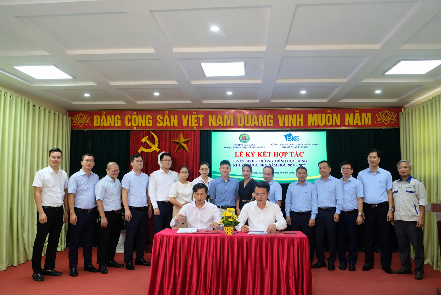 Group photo with Vietnamese screen artwork